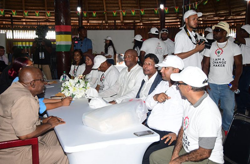 Former Prime Ministerial Candidate of Change Guyana, Nigel Hinds (fourth right) joins his party last Friday to hand in their lists (Adrian Narine)