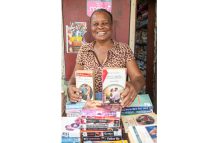 Dawn Smith-Greaves displaying some of her books