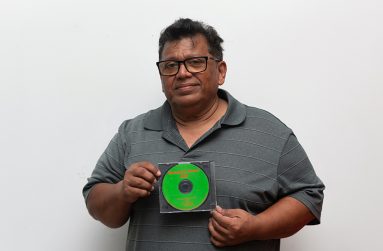 Ahamad Ally displaying his latest CD