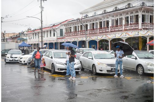 Taxi drivers sourcing passengers outside of Demico House, Stabroek (Delano Williams photos)