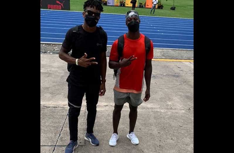 Damon Williams (left) and Emanuel Archibald after competing at the JAAA Olympic Destiny Series Long Jump event.