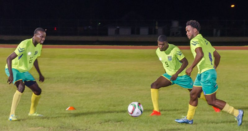 Golden Jaguars (L to R) Daniel Wilson, Dwight Peters and Vurlon Mills getting warmed up before training started last night.