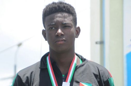 Guyana's Daniel Scott won silver in the boys 200m freestyle after a tough fight against Suriname's Enrico Molly. Guyana's Antonio Rodrigues was third (Delano Williams photo)