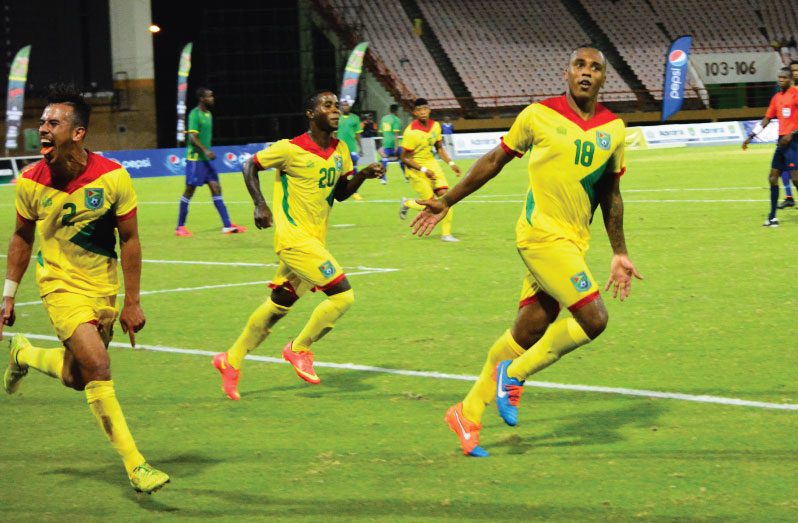 FLASHBACK to 2015! Neil Danns (first from left) celebrates after scoring his second goal against St Vincent and the Grenadines at the Guyana National Stadium in the 2018 World Cup Qualifier. Also in photo, from left, are Samuel Cox and Trayon Bobb. (Samuel Maughn photo)