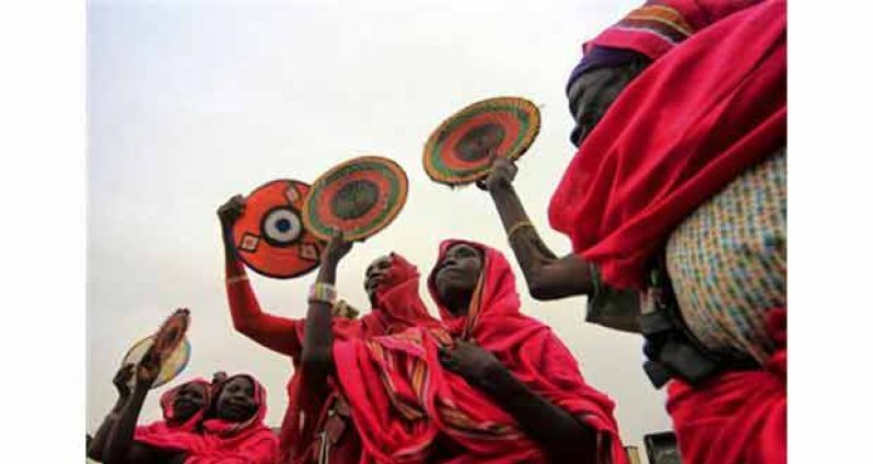 Darfuri women participate in a peace rally on International Peace Day at the town of Al -Fashir in North Darfur. (Reuters photo)
