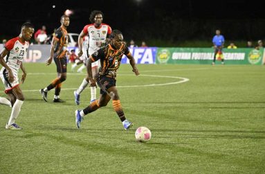 Darron Niles on the ball for Slingerz Football Club against Mondedderlust Football Club on Boxing Night