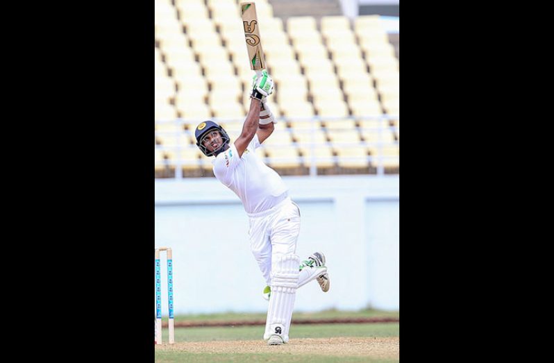 Sri Lanka’s Dasun Shanaka plays a lofted drive during his unbeaten 102 on the first day of the second `Test’ at Trelawny
