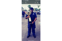 David Williams posing with one of his CPG trophies as a community-based leader