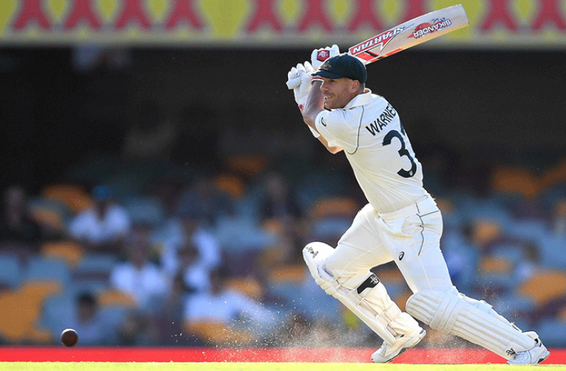 Australia opener David Warner carries his bat on day two to reach stumps on 151. (Getty Images)