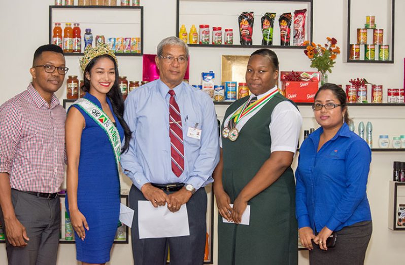 At Monday’s presentation ceremony. From left are: DeSinco’s Senior Brand and Marketing Manager, Mr Mark Kendall; Miss World Guyana, Vena Mookram; DeSinco General Manager, Mr. Frank DeAbreu; Gold Medalist, Ms Jemeicia Scott; and DeSinco Human Resources Manager (Photo by Samuel Maughn)