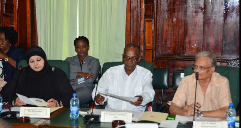 From right are  Education Minister  Dr Rupert Roopnaraine; Opposition MP, Joseph Hamilton; and Aleema Nazir of the Rights of the Child Commission. They performed the role of judges at the special sitting Monday of the Youth Parliament
