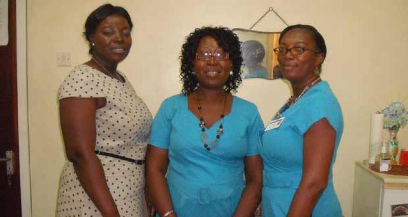 From left are Deputy Chief Librarian (Ag) Nadine Moore; Senior Librarian Assistant Shellyann Fraser; and Supervisor for the Juvenile Department, Ms Francica Burgess.