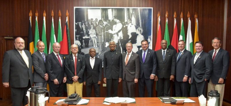 President David Granger (centre) and members of the US Congress . Vice President and Minister and Minister  of Foreign Affairs , Carl Greenidge is at the President's right  while Minister of State , Joseph Harmon is fourth from right. At left is US ambassador to Guyana , Perry Holloway. (MOTP photo)