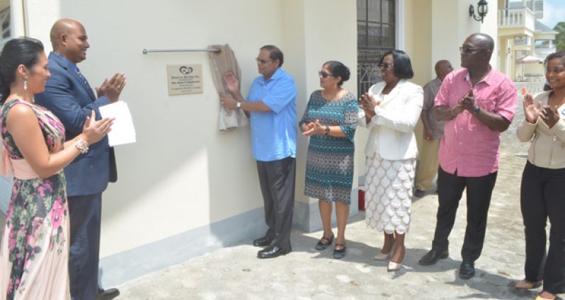 Prime Minister Moses Nagamootoo unveils the plaque to open Demerara Paradise. At left is Dr. Vivakeanand Bridgemohan and his wife.