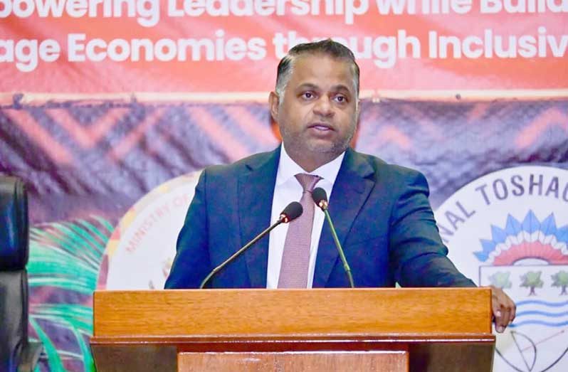 Minister of Public Utilities and Aviation, Deodat Indar, addresses village leaders at the NTC Conference 2026