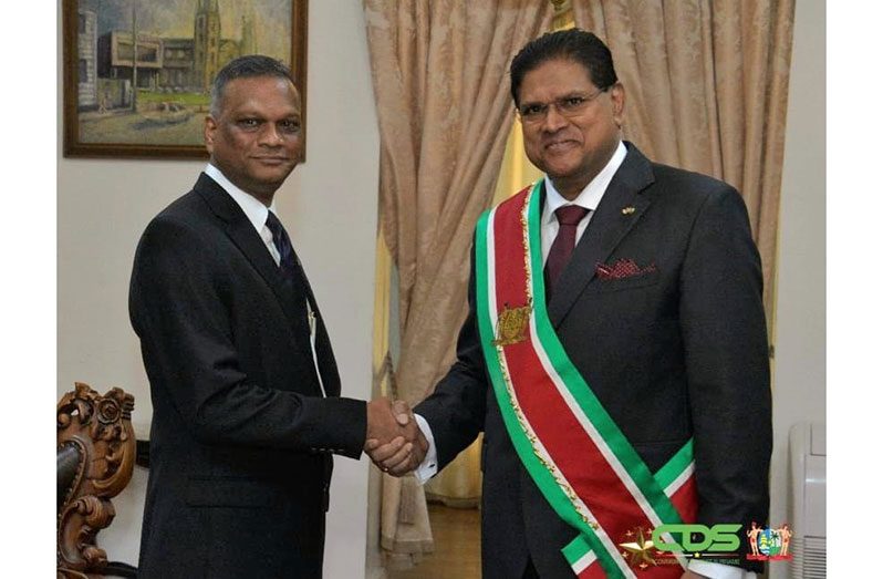 President of Suriname, Chandrikapersad Santokhi (right) and Guyana’s newly accredited Ambassador, Virjanand Depoo