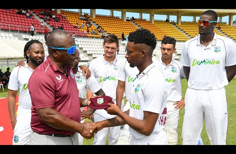 Desmond Haynes (left) presents a cap to Alick Athanaze