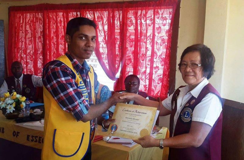Persaud receiving an award when he served as a Lions Club member