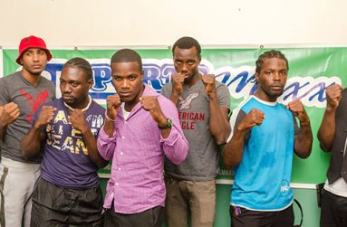 Some of the boxers, who will be on show at the GBBC’s `Bad Intentions’ card set for the Giftland Mall on August 27, strike a pose for photographer Delano Williams yesterday, after signing their respective contracts. Third right is Dexter Gonsalves who will fight American De Marcus `Chop Chop’ Corley for the WBC FECABOX lightweight title.