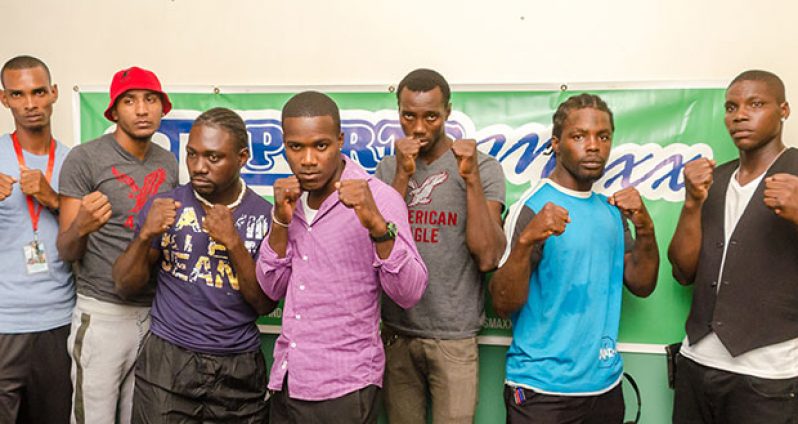 Some of the boxers, who will be on show at the GBBC’s `Bad Intentions’ card set for the Giftland Mall on August 27, strike a pose for photographer Delano Williams yesterday, after signing their respective contracts. Third right is Dexter Gonsalves who will fight American De Marcus `Chop Chop’ Corley for the WBC FECABOX lightweight title.