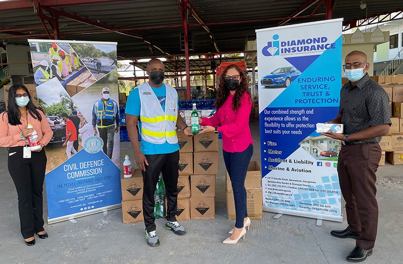 Representatives of the company donate the items to Deputy Director General of the CDC, Major Loring Benons