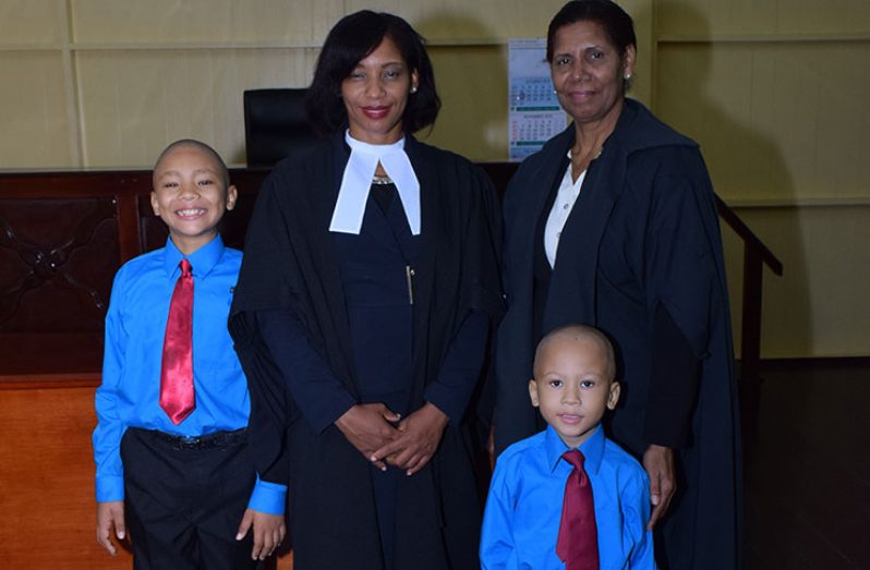 Diane Barker with Justice Sandra Kurtzious and her children following her admittance to the Bar