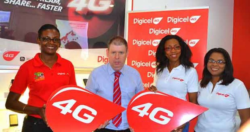 Digicel Guyana CEO Kevin Kelly is flanked by staff following the launch of the company’s 4G network. At right is PRO Vidya Sanchara, and next to her is Digicel's Head of Marketing, Ms. Jacqueline James