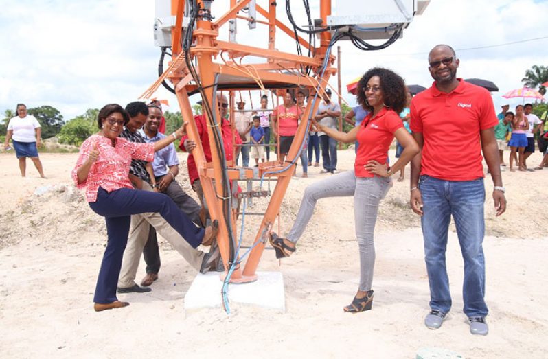 An elated Minister of Public Telecommunications, Ms Cathy Hughes (left) with Digicel Guyana and other officials at the newly commissioned cell tower