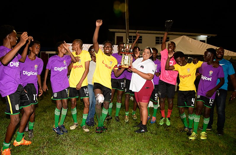 Buxton, winner of the East Coast leg of the Digicel Schools Football tournament 2023 collect their trophy