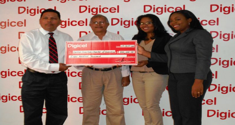 Receiving the cheque on behalf of the Central Corentyne Chamber of Commerce are Krishnanand Raghunandan and Tajpaul Adjodhea, from Digicel representatives Vidya Sanichara and Louanna Abrams  