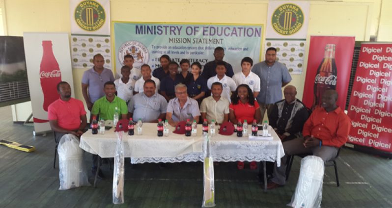 The head table takes a photo opportunity following the launch of the National Secondary Schools League with students from Marian Academy.