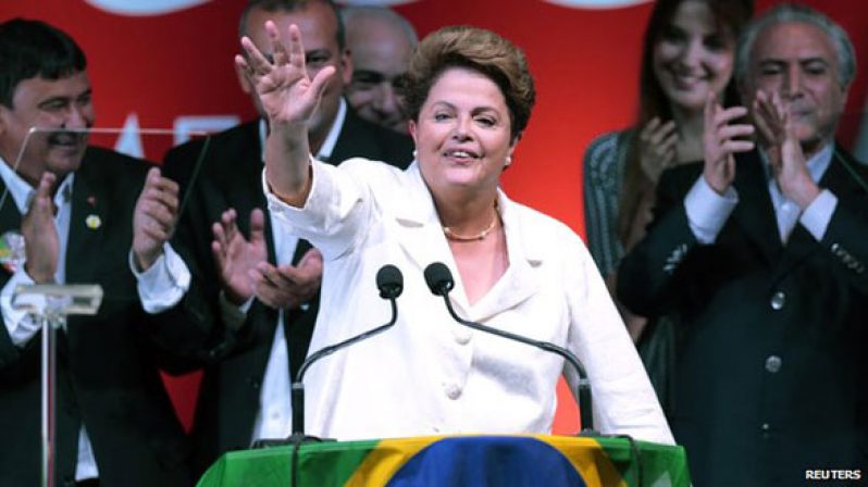 A triumphant Dilma Rousseff making her victory speech in Brasilia yesterday