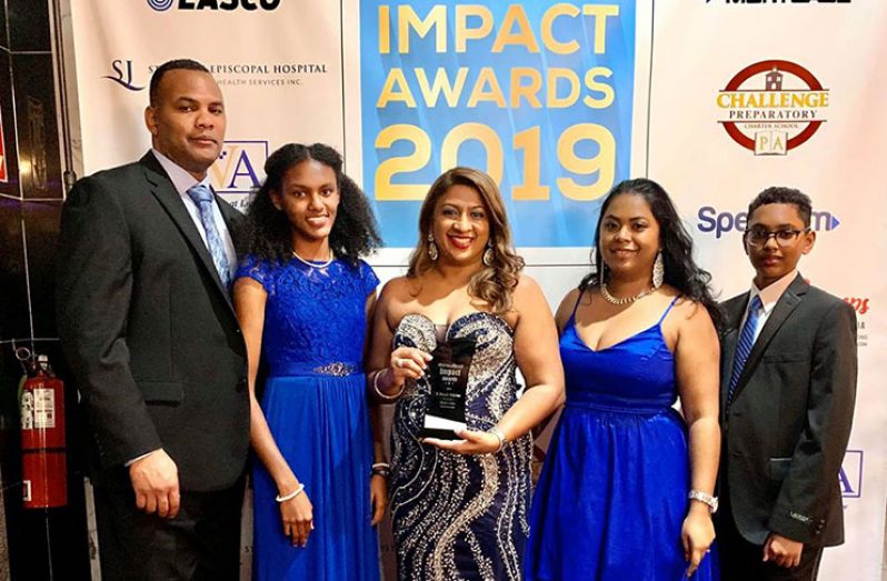 With her husband and children recently at the Caribbean Life Impact Awards.  