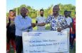 GFF Third Vice-President, Dion Innis (right) makes the presentation to a representative of the East Coast Demerara Football Association.