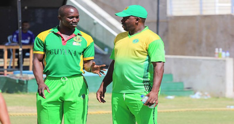 Head coach Esaun Crandon (right) and his assistant Rayon Griffith who also doubles as manager of the team, discuss strategies before the start of play on the final day against the Jamaica Franchise at Sabina Park, Jamaica, in the fifth round. (Photo courtesy flickr.com/WICB Media)