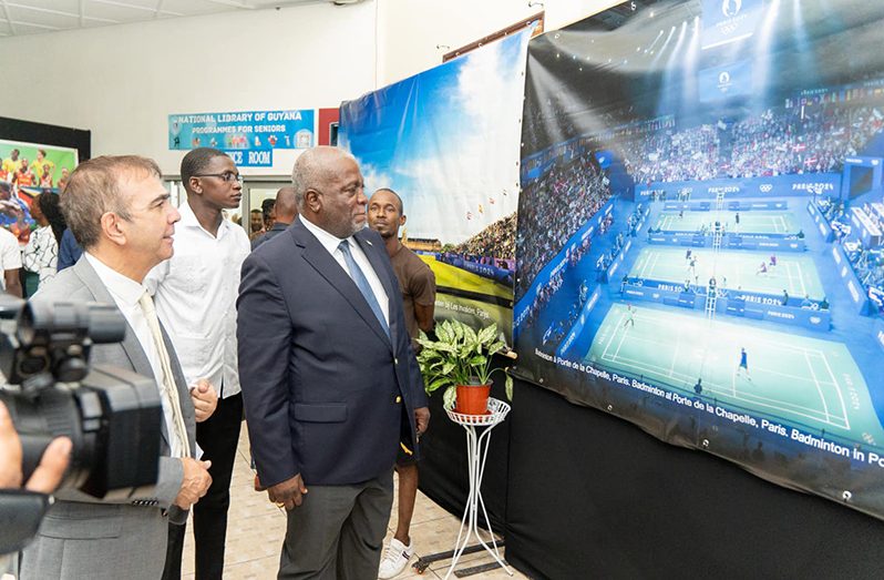 Prime Minister Brigadier (Ret'd), Mark Phillips looks at the exhibitions of the upcoming Paris Olympics at the Guyana National Library