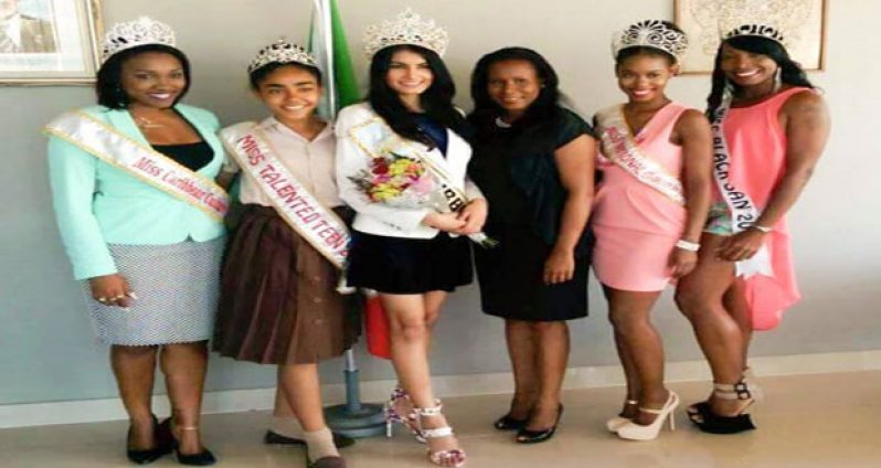 Reigning Miss Guyana World Rafeiya Husain (center) flanked by pageant beauties in St. Kitts