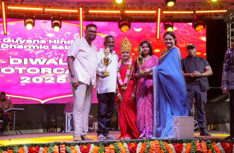 President Dr Mohamed Irfaan Ali and Minister of Human Services and Social Security, Dr Vindhya Persaud, awarding trophies at the end of the night’s Diwali celebration