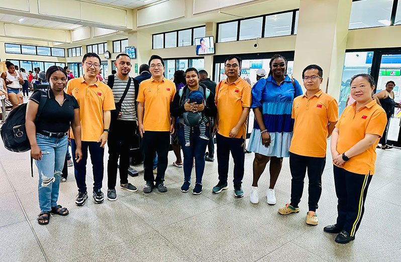 Four of the Guyanese doctors flanked by members of the 19th China Medical Team who recently bid farewell to their colleagues and supporters at the CJIA