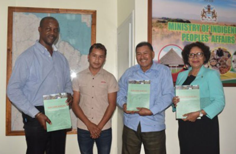 Indigenous Peoples’ Affairs Permanent Secretary Alfred King, Minister of Indigenous Peoples’ Affairs Sydney Allicock and Minister within the Ministry Valerie Garrido-Lowe with copies of the report