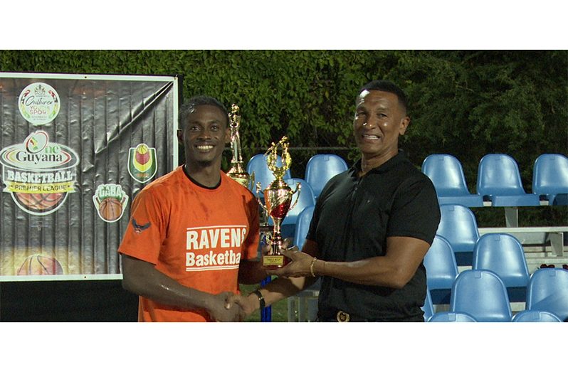Dominic Vincente Collecting finals MVP trophy from NSC Chairman Kashif Mohammed