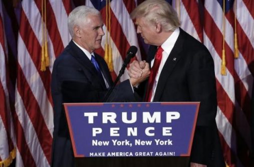 Donald Trump greets his running mate Mike Pence during his election night rally in Manhattan.    REUTERS/Mike Segar