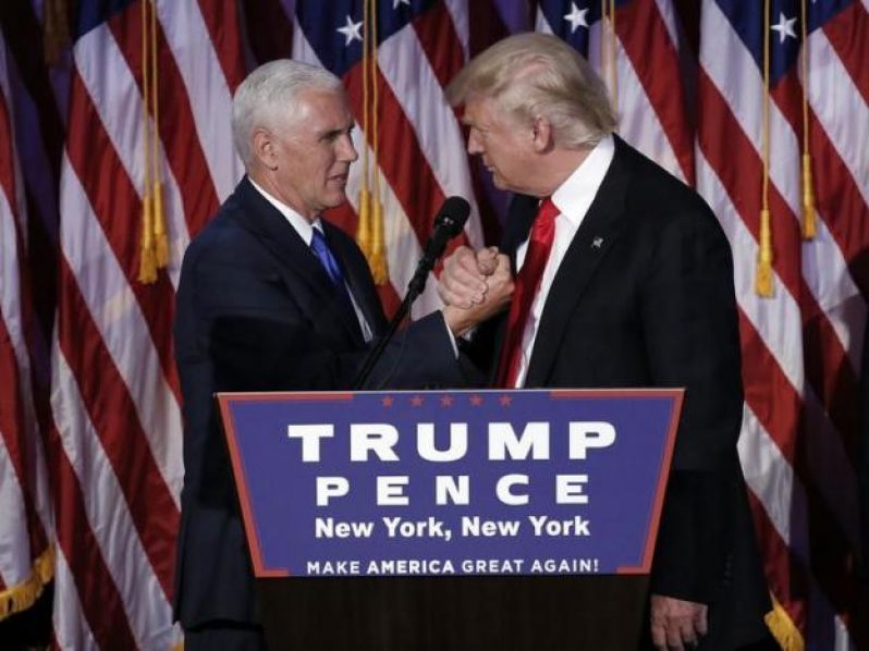 Donald Trump greets his running mate Mike Pence during his election night rally in Manhattan.    REUTERS/Mike Segar