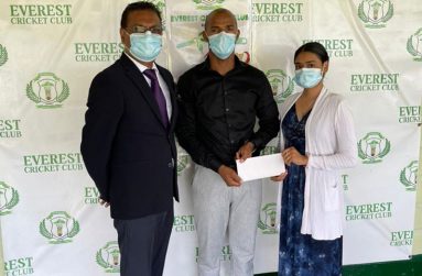 President of Fruta Conquerors, Colin Gittens, receives the sponsorship of $100 000 from ECC manager Krista Norton. Also present is ECC president Manzoor Nadir.