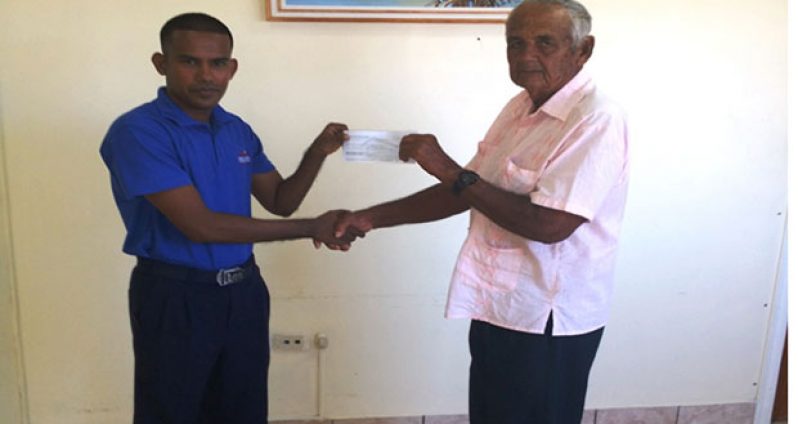 Mr. Amarnauth Singh, Administrative Supervisor of the Berbice Bridge Company Inc. presents the cheque for GY $150,000 to the Canaan Children’s Home