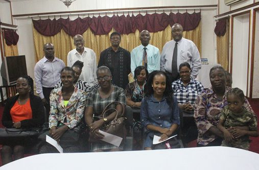 Seated are some of the recipients of donations from the Guyana Police Force Fallen Heroes Foundation Inc with members of the foundation