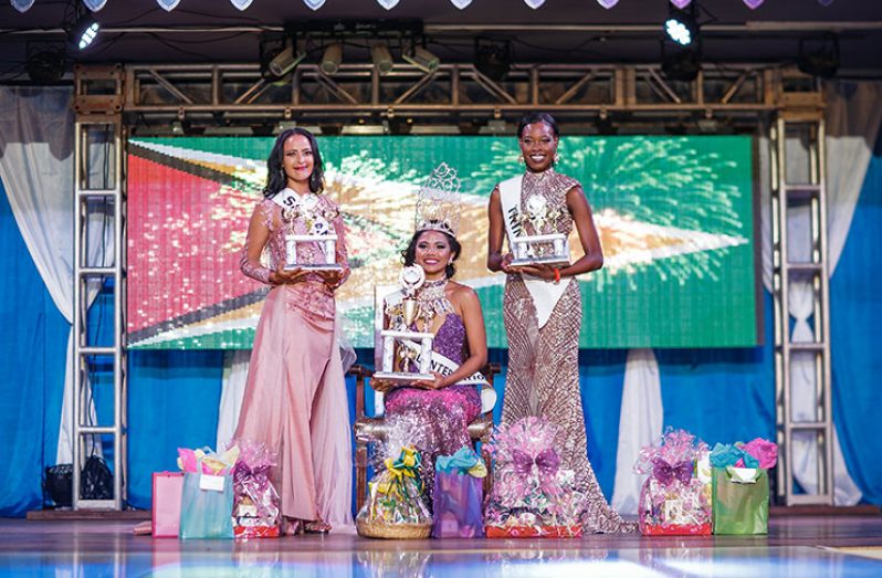At the Miss Global International 2017 pageant. Left is first runner-up San Andreas' Annie Newball; while right is second runner-up, Djennica Francis, of Trinidad & Tobago. 
Seated centre is Guyana's Cynthia Dookie (Photos courtesy of Miss Global International Guyana)