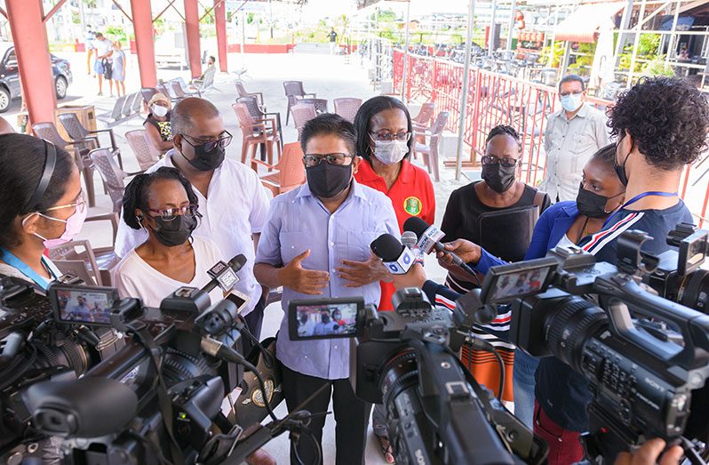 Senior Minister within the Office of the President with responsibility for Finance, Dr. Ashni Singh, speaks with members of the press during an NIS outreach at the Giftland Mall on Saturday (Delano Williams photo)