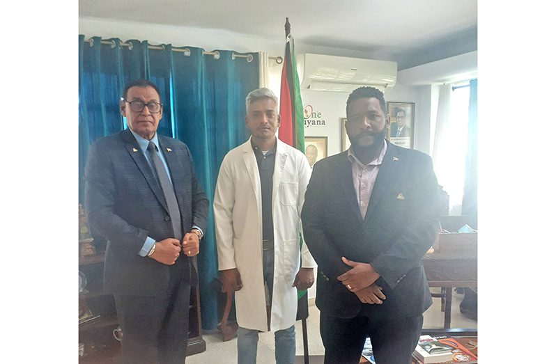 Urologist Dr. Devendra Radhay (centre) flanked by Guyana's Ambassador to Cuba, Halim Majeed (left) and Mr. Quincy Younge