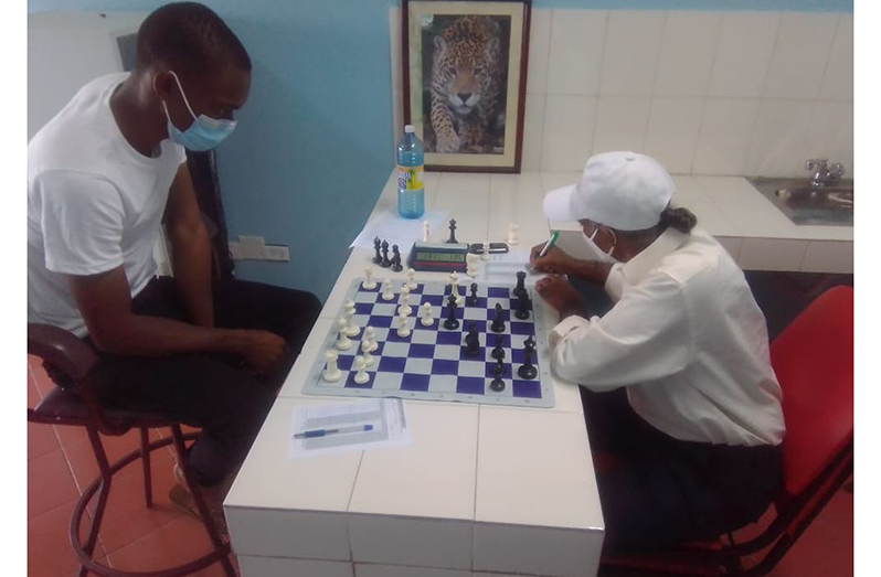 Anthony Drayton (left) and Rai Sharma during their opening clash.